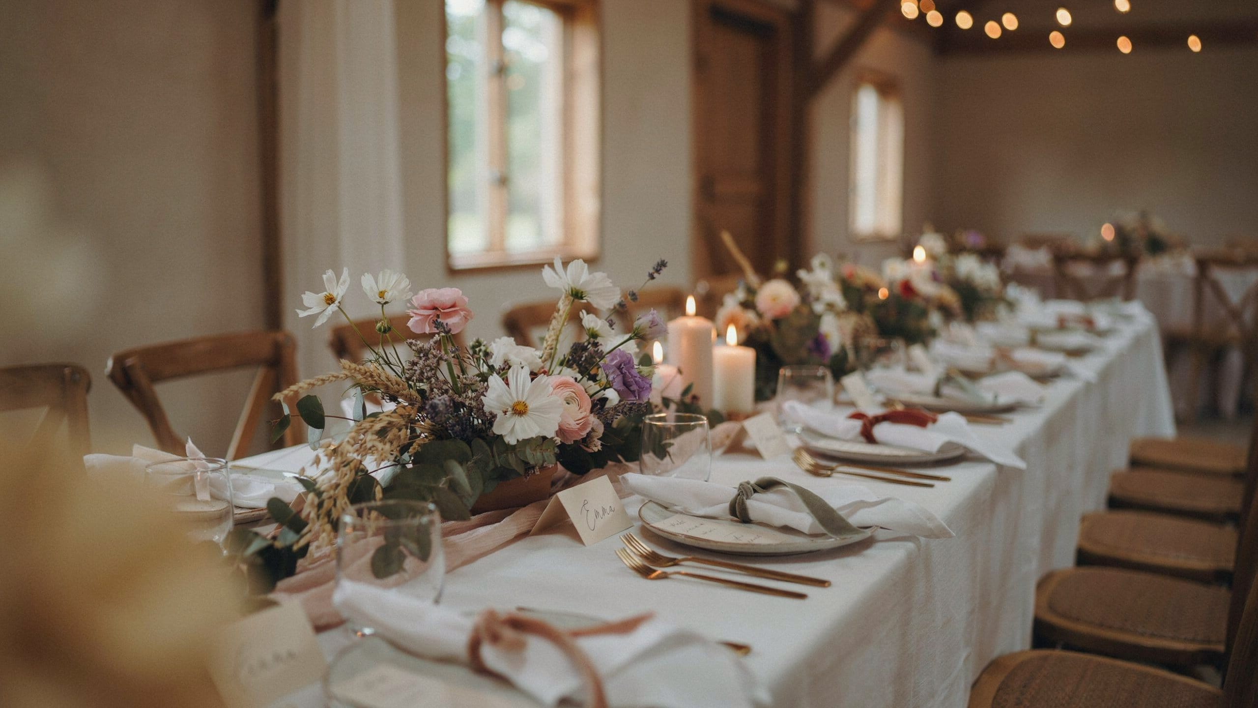 Simple elegant budget wedding reception table setting with terracotta ribbon